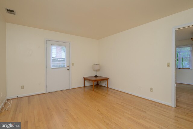 5151 19th Rd N, Arlington, VA 22207 - empty room featuring light wood finished floors, plenty of natural light, and baseboards