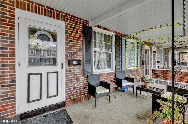 314 Summit Ave, Reading, PA 19611 - property entrance with covered porch and brick siding