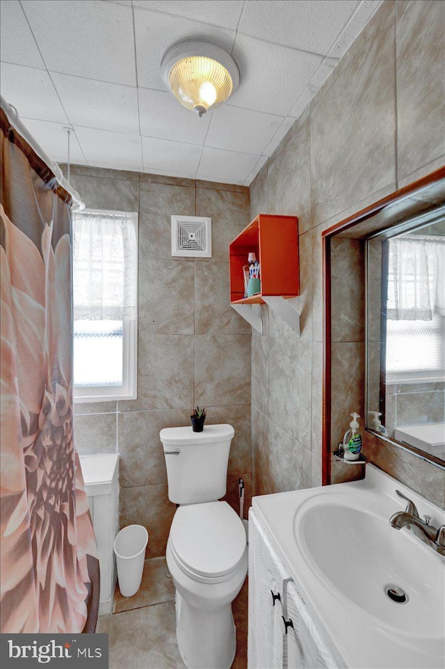 314 Summit Ave, Reading, PA 19611 - bathroom featuring toilet, tile walls, and vanity