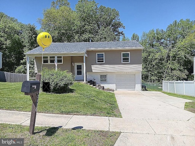 2425 W Colonial Dr, Upper Chichester, PA 19061 - raised ranch featuring concrete driveway and an attached garage