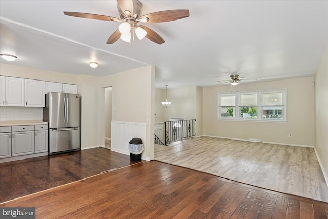 2425 W Colonial Dr, Upper Chichester, PA 19061 - unfurnished living room featuring ceiling fan and dark wood finished floors