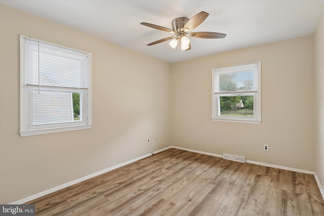 2425 W Colonial Dr, Upper Chichester, PA 19061 - empty room featuring light wood-style flooring, baseboards, and ceiling fan