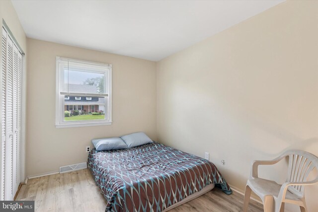 2425 W Colonial Dr, Upper Chichester, PA 19061 - bedroom featuring wood finished floors, baseboards, and a closet