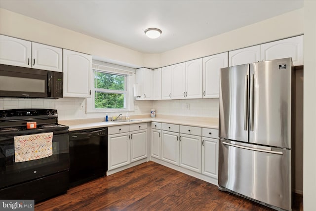 2425 W Colonial Dr, Upper Chichester, PA 19061 - kitchen featuring black appliances, white cabinets, a sink, and backsplash