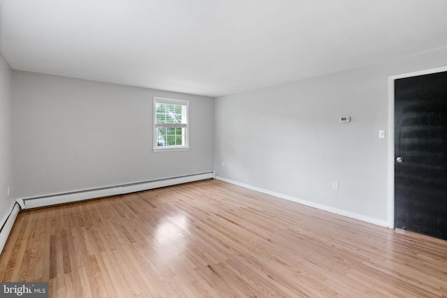 2958 Hannah Ave, Norristown, PA 19401 - unfurnished room with wood finished floors, a baseboard heating unit, and baseboards