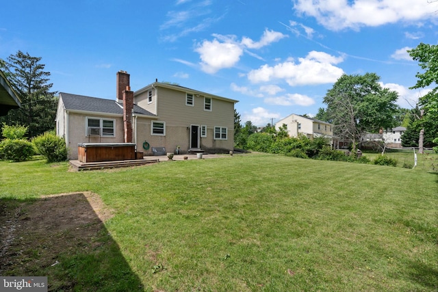 2958 Hannah Ave, Norristown, PA 19401 - rear view of property featuring a hot tub, a chimney, a patio area, and a yard