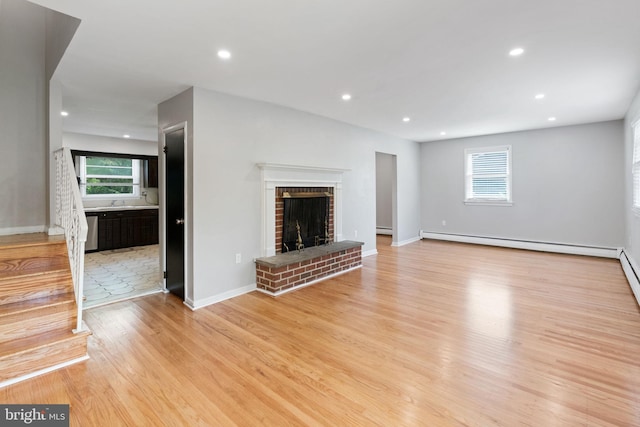 2958 Hannah Ave, Norristown, PA 19401 - unfurnished living room featuring a baseboard radiator, light wood finished floors, healthy amount of natural light, baseboards, and recessed lighting
