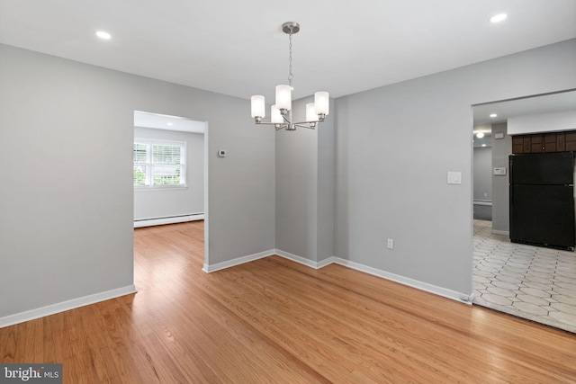 2958 Hannah Ave, Norristown, PA 19401 - spare room featuring baseboard heating, a chandelier, light wood-style floors, baseboards, and recessed lighting