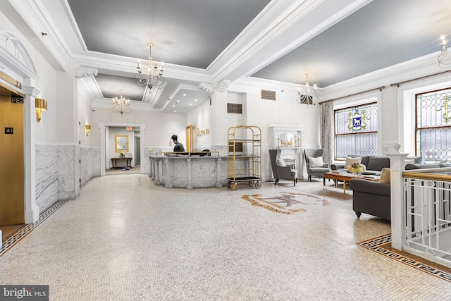 1811 Chestnut St Unit 104, Philadelphia, PA 19103 - welcome area featuring a chandelier, a wainscoted wall, ornamental molding, and decorative columns