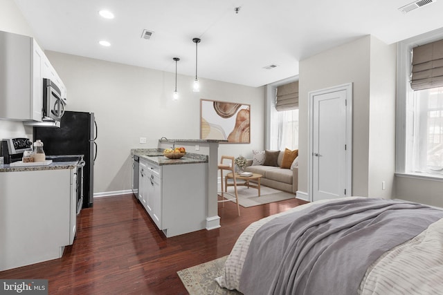 1811 Chestnut St Unit 104, Philadelphia, PA 19103 - bedroom featuring dark wood finished floors, multiple windows, recessed lighting, baseboards, and a sink