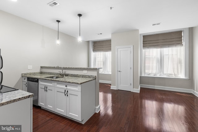 1811 Chestnut St Unit 104, Philadelphia, PA 19103 - kitchen featuring a sink, stainless steel dishwasher, a peninsula, light stone countertops, and white cabinets