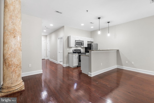 1811 Chestnut St Unit 104, Philadelphia, PA 19103 - kitchen with stainless steel appliances, dark wood finished floors, a peninsula, baseboards, and recessed lighting