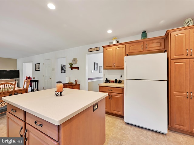 15 Behrens Dr, Palmyra, PA 17078 - kitchen featuring freestanding refrigerator, a center island, light countertops, light tile patterned floors, and recessed lighting