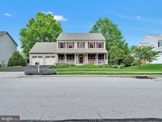 15 Behrens Dr, Palmyra, PA 17078 - colonial inspired home featuring covered porch, a garage, driveway, and a front yard