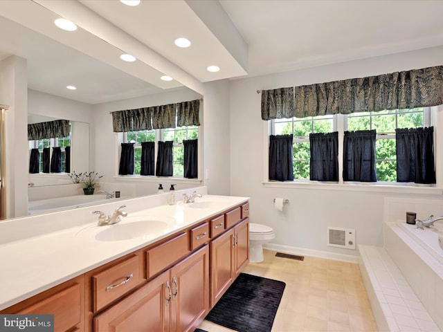 15 Behrens Dr, Palmyra, PA 17078 - full bath featuring double vanity, a garden tub, plenty of natural light, baseboards, and recessed lighting