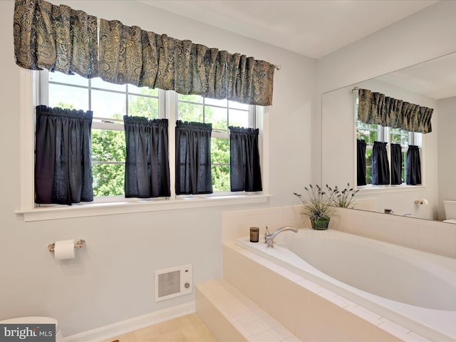 15 Behrens Dr, Palmyra, PA 17078 - bathroom featuring toilet, a bath, and healthy amount of natural light
