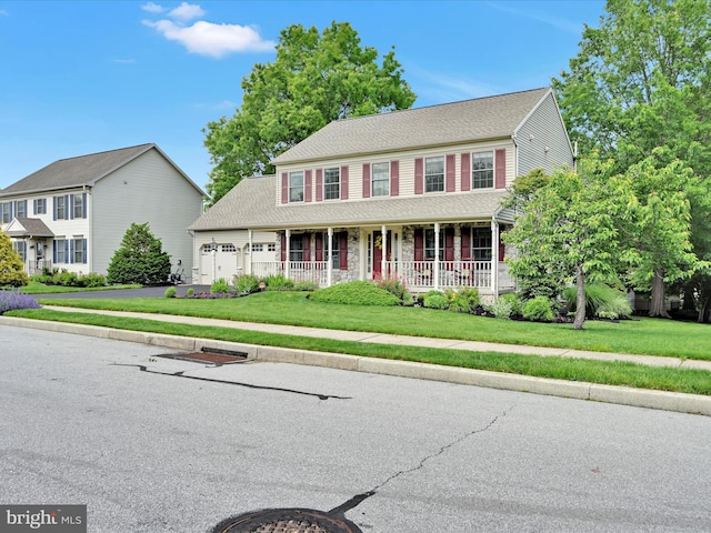 15 Behrens Dr, Palmyra, PA 17078 - colonial inspired home featuring covered porch, a garage, and a front yard