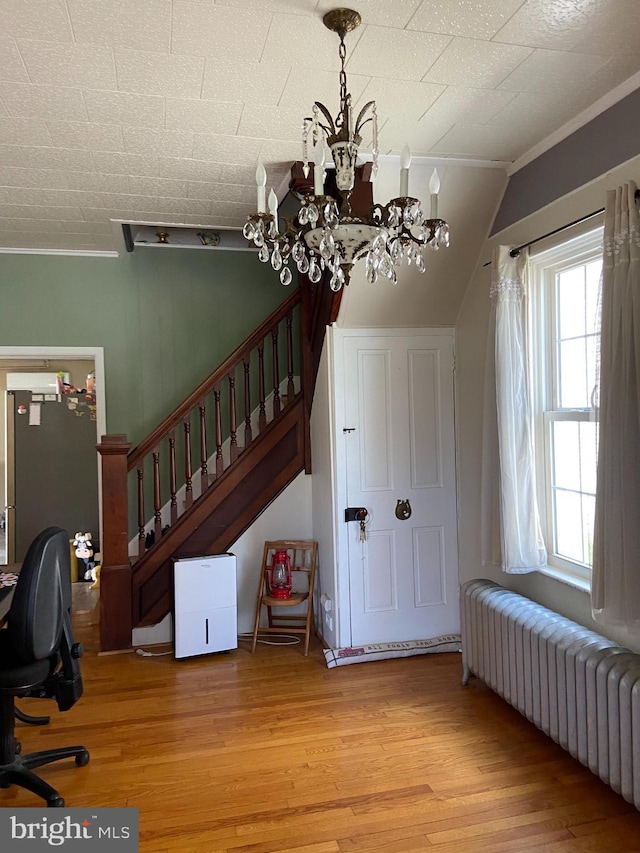 10 Whyte St, Union Bridge, MD 21791 - home office featuring radiator heating unit, healthy amount of natural light, wood finished floors, and a chandelier