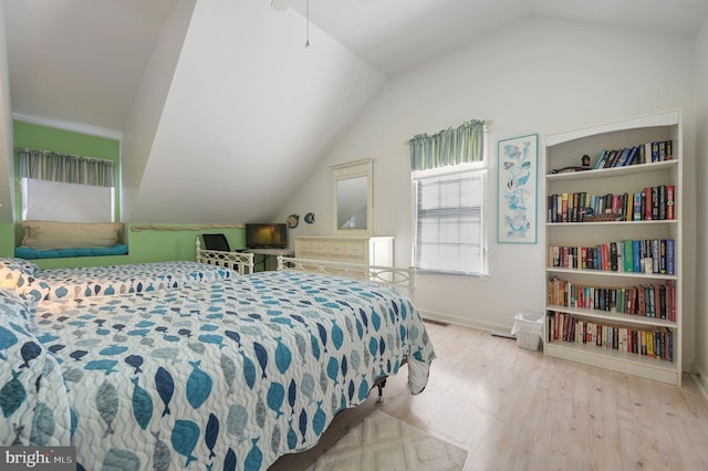 635 Sandy Point Rd, Bethany Beach, DE 19930 - bedroom featuring vaulted ceiling, wood finished floors, and baseboards