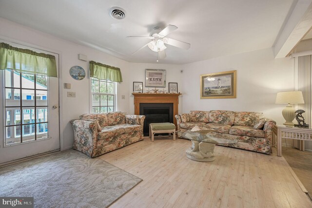 635 Sandy Point Rd, Bethany Beach, DE 19930 - living room with wood finished floors, ceiling fan, and a fireplace