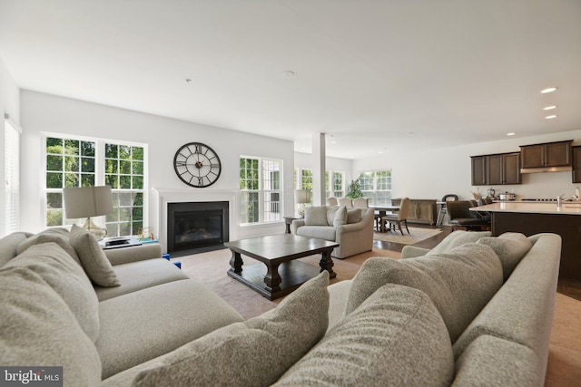 5809 Savannah Dr, Brandywine, MD 20613 - living room featuring recessed lighting, a fireplace with flush hearth, and light colored carpet