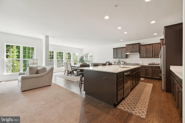 5809 Savannah Dr, Brandywine, MD 20613 - kitchen featuring open floor plan, dark wood finished floors, recessed lighting, dark brown cabinetry, and light countertops