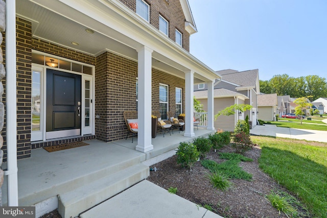 5809 Savannah Dr, Brandywine, MD 20613 - doorway to property featuring a porch, brick siding, and a residential view
