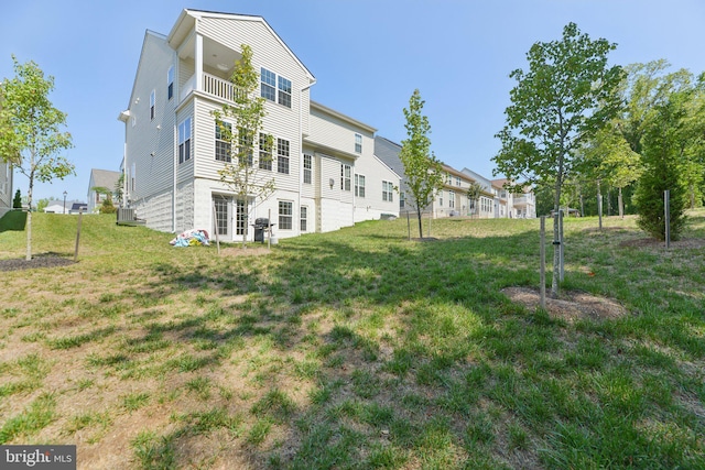 5809 Savannah Dr, Brandywine, MD 20613 - rear view of house with a yard, a balcony, central AC, and a residential view