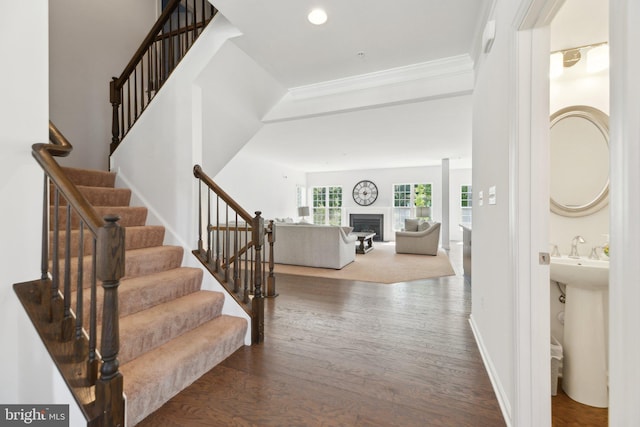 5809 Savannah Dr, Brandywine, MD 20613 - foyer entrance with wood finished floors, stairway, a fireplace, ornamental molding, and recessed lighting