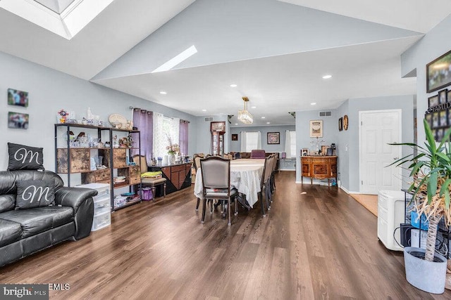 1177 Aster Dr, Toms River, NJ 08753 - dining area with dark wood-style flooring, a skylight, recessed lighting, and vaulted ceiling