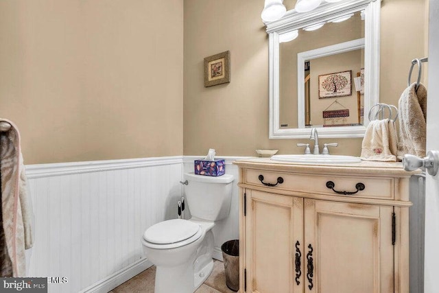 1177 Aster Dr, Toms River, NJ 08753 - half bathroom featuring vanity, a wainscoted wall, and toilet