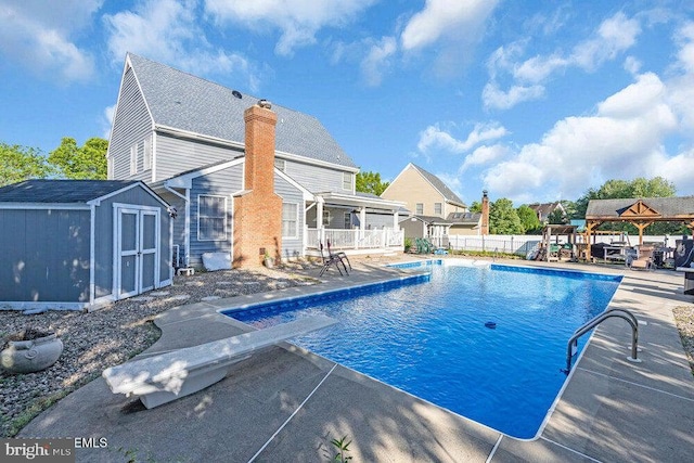 1177 Aster Dr, Toms River, NJ 08753 - view of swimming pool featuring a patio area, a gazebo, a diving board, and a playground