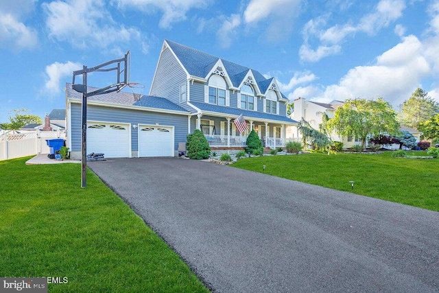 1177 Aster Dr, Toms River, NJ 08753 - victorian-style house with covered porch, a garage, and driveway