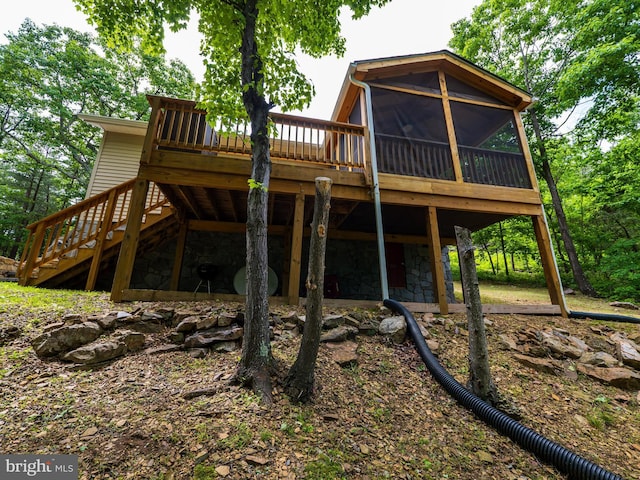 1502 Tomahawk Trl, Winchester, VA 22602 - rear view of property featuring stairway, a sunroom, a deck, and stone siding