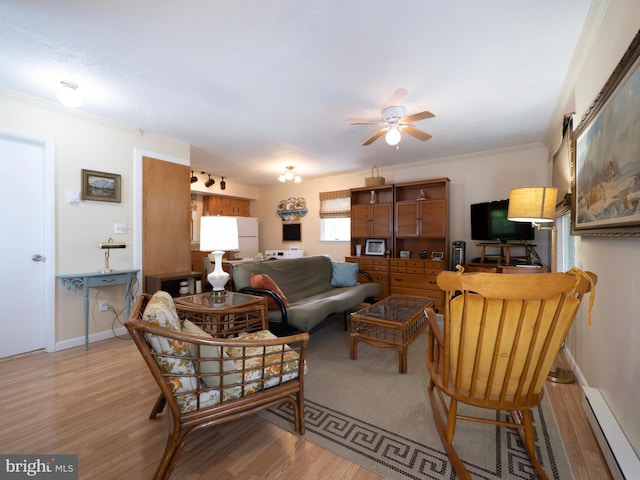 1502 Tomahawk Trl, Winchester, VA 22602 - living room with a ceiling fan, light wood-style floors, crown molding, baseboards, and baseboard heating