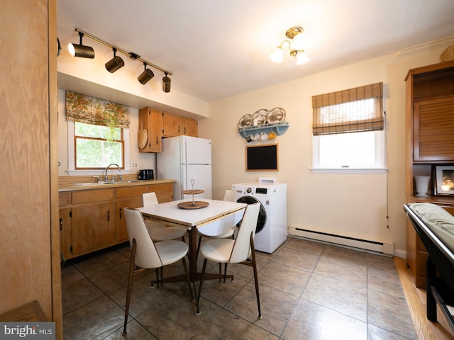 1502 Tomahawk Trl, Winchester, VA 22602 - kitchen with a baseboard heating unit, freestanding refrigerator, washer / clothes dryer, a sink, and light countertops