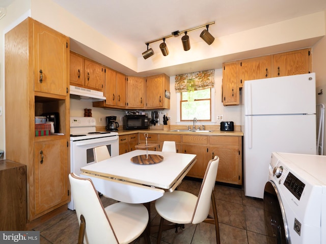 1502 Tomahawk Trl, Winchester, VA 22602 - kitchen with under cabinet range hood, a sink, white appliances, washer / dryer, and light countertops