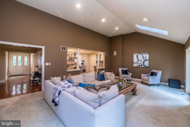 23 Street Rd, Newtown Square, PA 19073 - carpeted living area featuring lofted ceiling, a chandelier, a skylight, baseboards, and recessed lighting