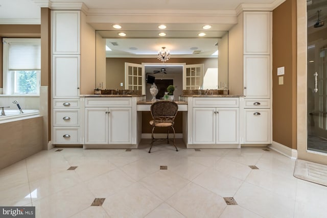 23 Street Rd, Newtown Square, PA 19073 - full bathroom with vanity, crown molding, a garden tub, a shower stall, and baseboards