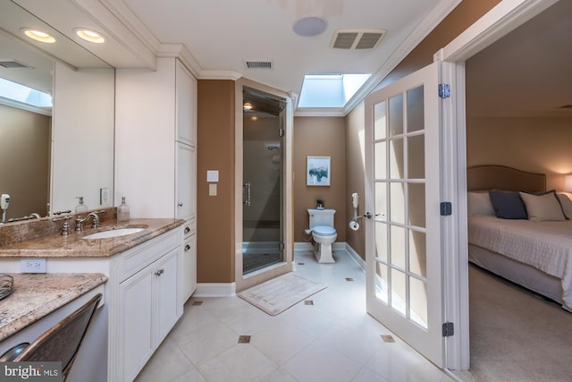 23 Street Rd, Newtown Square, PA 19073 - ensuite bathroom featuring a stall shower, vanity, a skylight, toilet, and crown molding