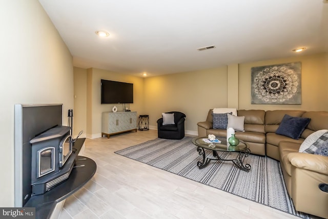 23 Street Rd, Newtown Square, PA 19073 - living room with a wood stove, baseboards, wood finished floors, and recessed lighting