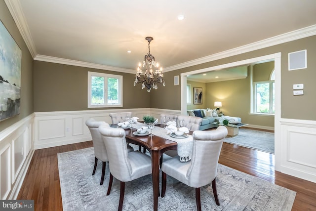 23 Street Rd, Newtown Square, PA 19073 - dining space with plenty of natural light, a chandelier, crown molding, dark wood finished floors, and a wainscoted wall