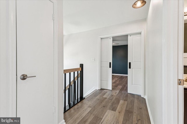 963 Breakwater Dr, Annapolis, MD 21403 - corridor featuring an upstairs landing, wood finished floors, and baseboards