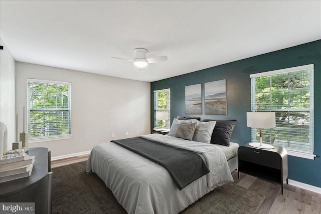 963 Breakwater Dr, Annapolis, MD 21403 - bedroom with wood finished floors, baseboards, and multiple windows