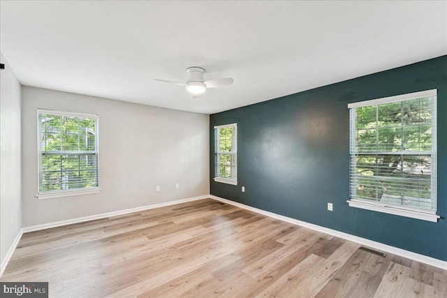 963 Breakwater Dr, Annapolis, MD 21403 - unfurnished room featuring plenty of natural light, wood finished floors, and baseboards