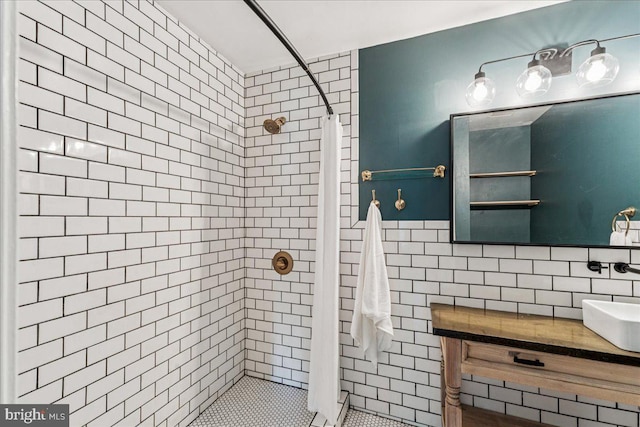 963 Breakwater Dr, Annapolis, MD 21403 - bathroom featuring a stall shower, tile walls, and vanity