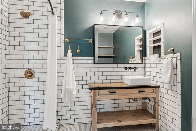 963 Breakwater Dr, Annapolis, MD 21403 - bathroom with tile walls, a stall shower, vanity, and tile patterned floors
