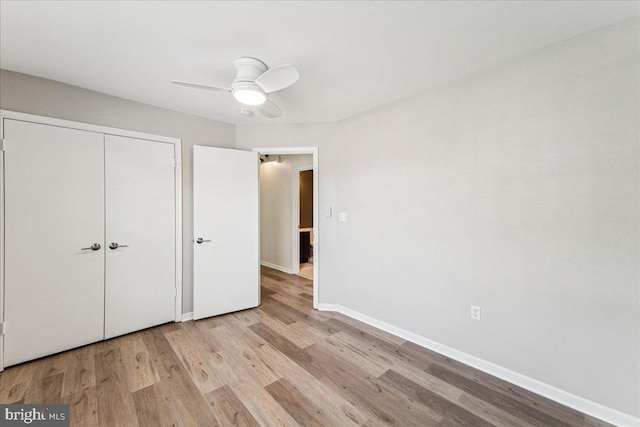 963 Breakwater Dr, Annapolis, MD 21403 - unfurnished bedroom with wood finished floors, baseboards, a closet, and a ceiling fan