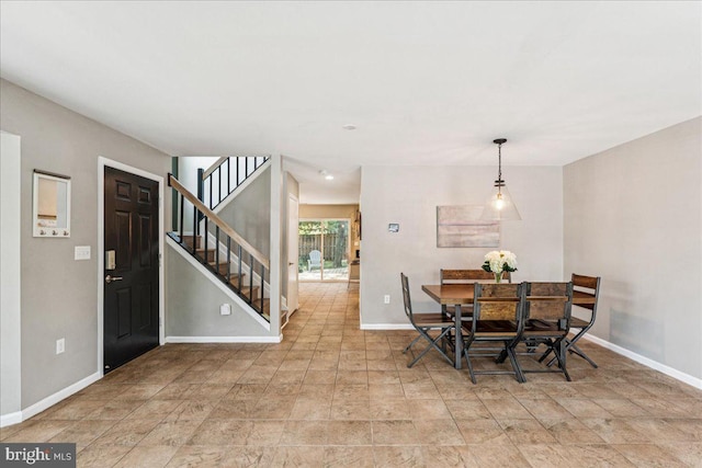 963 Breakwater Dr, Annapolis, MD 21403 - dining room featuring baseboards, stairway, and stone finish floors