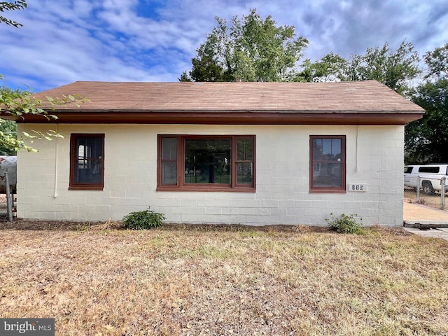 515 Burton Ave, Cambridge, MD 21613 - view of home's exterior with concrete block siding and roof with shingles